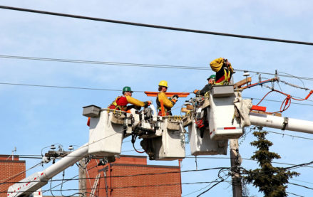 Field service technicians repairing electrical wires