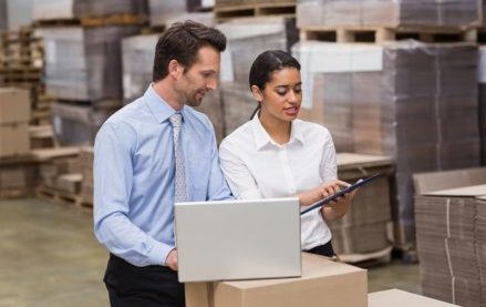 Warehouse workers using software