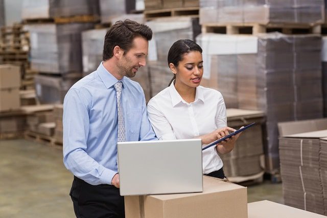 Warehouse workers using software