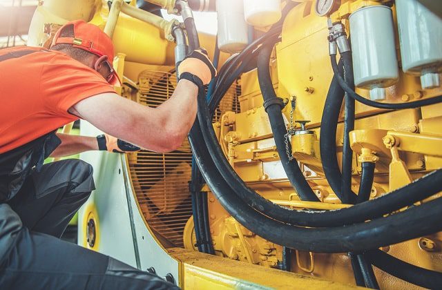 Mechanic repairing equipment part of MRO costs