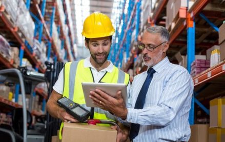 Manager and warehouse worker in a warehouse