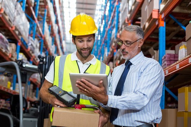 Manager and warehouse worker in a warehouse