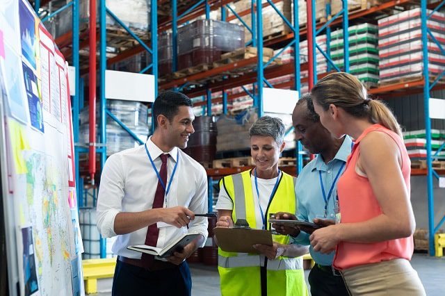 Team conducting planning in a warehouse