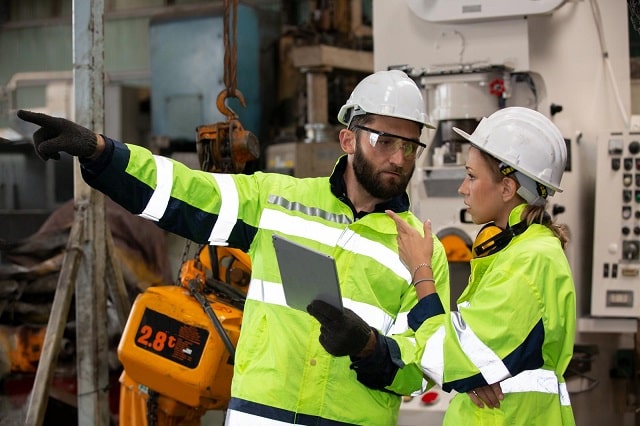 Maintenance technicians wearing safety gear