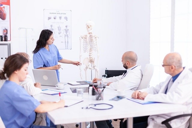 Healthcare providers in an office having a meeting
