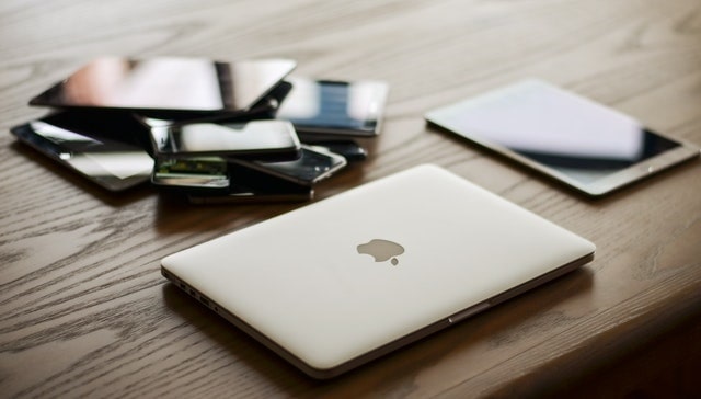 Mobile devices and laptop on a table