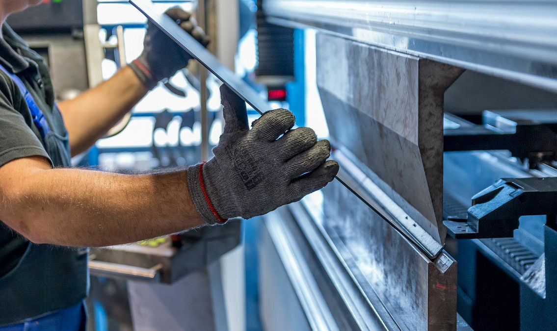 Worker using equipment in a facility