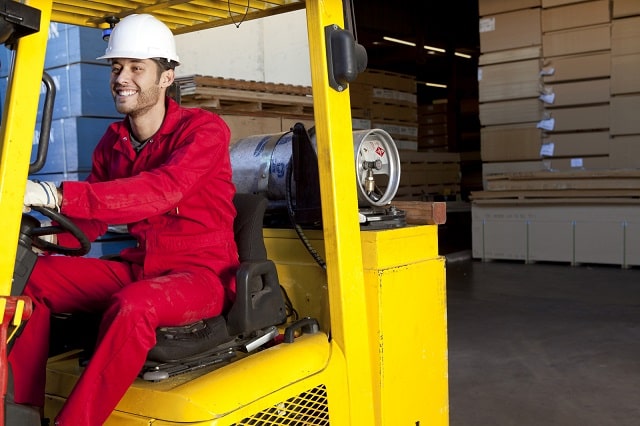 Man operating forklift