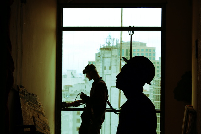 Workers inspecting an empty building