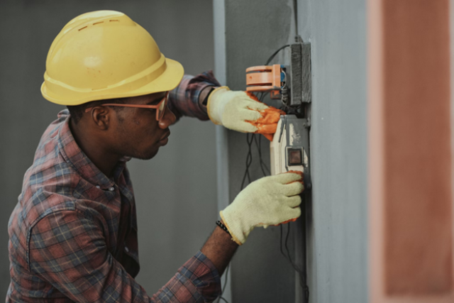 Worker performing maintenance on equipment