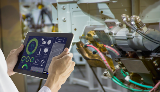Technician using CMMS software on a tablet