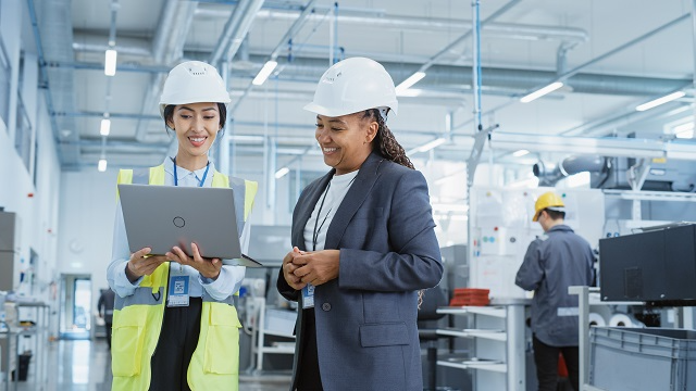 Facility manager discussing changing needs with a worker 