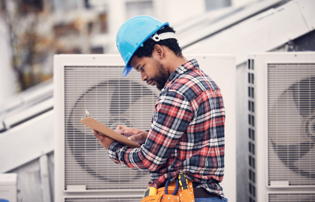 Maintenance worker checking maintenance plan 