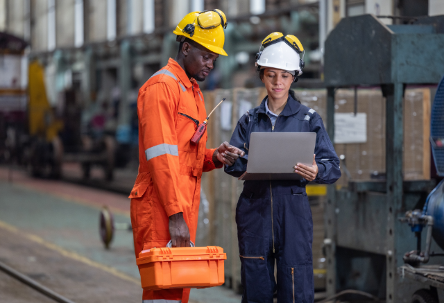 Maintenance workers reviewing work orders