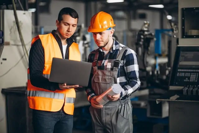 An engineer and a workman in a factory