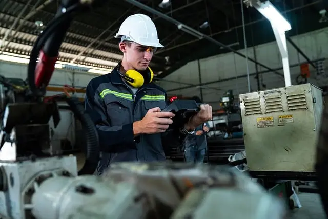 A maintenance engineer testing machinery