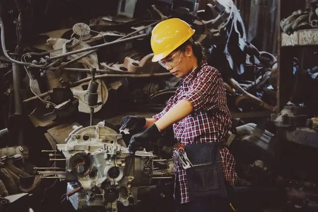 A female engineer maintaining equipment