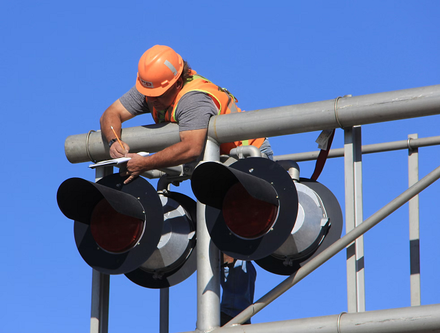 Performing maintenance or repairs on a stoplight