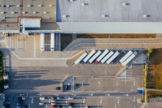 Overhead aerial view of trucks at a storage facility