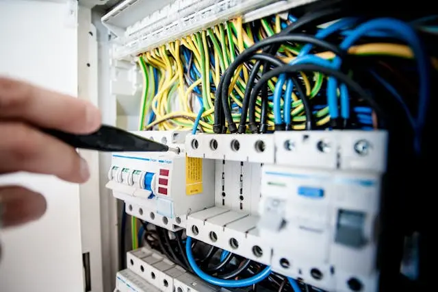 Close-up view of maintenance being performed on electrical wiring