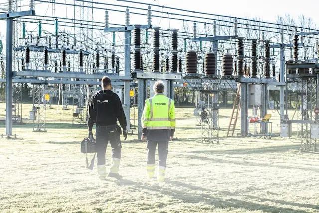 Engineers at an electrical transformer substation