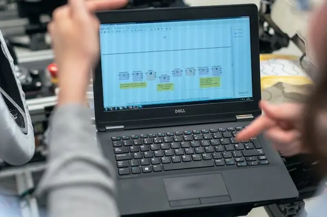 An engineer running tests with a laptop